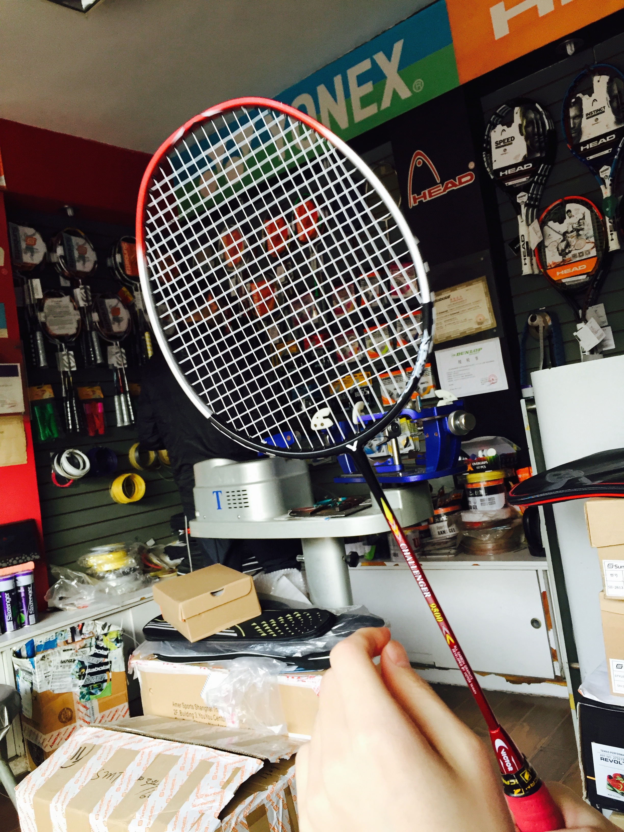 I went with my friend Xiao He to get his rackets restrung a few weeks ago. I got to watch the whole process. 